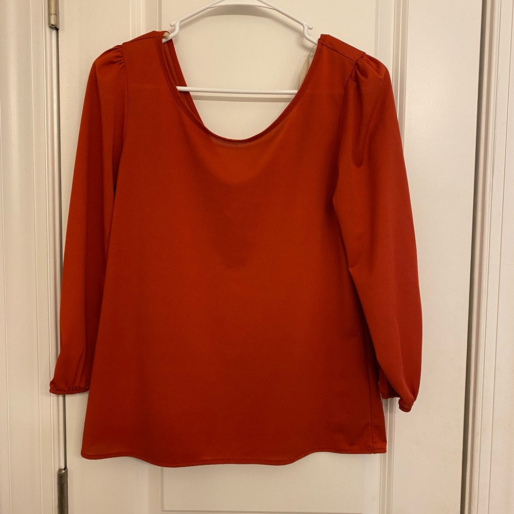 Coveted Clothing Zipper Back Blouse